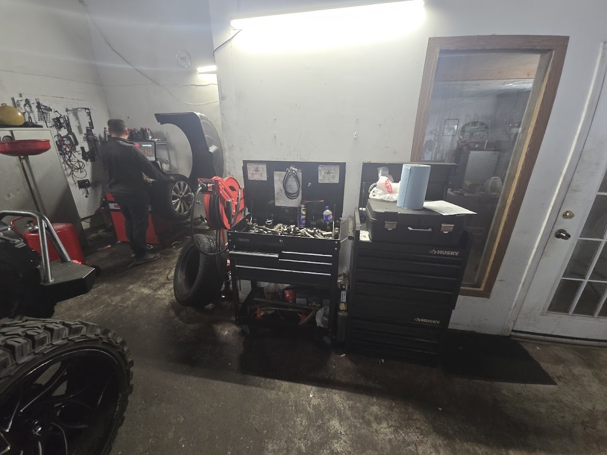 The ATL Mobile Auto Repair work area with tool chests and tire equipment